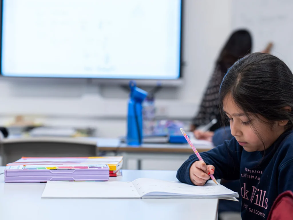 Pupil writing during a timed paper